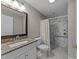 Bathroom featuring marble walk-in shower and vanity at 5122 Berkeley St, Raleigh, NC 27612