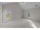 Large bedroom with vaulted ceilings, lots of natural light, and neutral carpet at 5122 Berkeley St, Raleigh, NC 27612