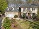 Traditional two-story home with a two-car garage, dormer windows and a well manicured lawn at 5122 Berkeley St, Raleigh, NC 27612