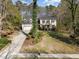 Charming home boasts a well-manicured lawn, mature trees, and inviting curb appeal at 5122 Berkeley St, Raleigh, NC 27612