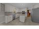 Open kitchen with white cabinets, granite countertops, and stainless steel appliances at 5122 Berkeley St, Raleigh, NC 27612