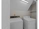 A laundry room with a vintage washer and modern dryer at 5122 Berkeley St, Raleigh, NC 27612