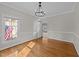 Living room with hardwood floors and view through open doorway at 5122 Berkeley St, Raleigh, NC 27612