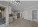 Open living space with tile flooring, modern lighting, and views into the kitchen and bathroom at 5122 Berkeley St, Raleigh, NC 27612