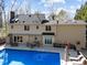 Exterior view of in-ground pool with deck and house, ideal for outdoor enjoyment at 5122 Berkeley St, Raleigh, NC 27612