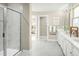 Bright bathroom boasts double sinks and a large walk-in shower at 557 Freedom Trail Dr, Willow Springs, NC 27592
