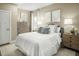 Relaxing bedroom with a queen-sized bed and neutral color palette at 557 Freedom Trail Dr, Willow Springs, NC 27592