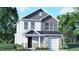 Charming two-story home featuring a mix of siding and stone, a covered porch, and an attached garage in a landscaped setting at 6037 Sodium St, Raleigh, NC 27610