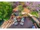 Aerial view of deck featuring outdoor lounge space amidst blooming trees at 620 Wills Forest St, Raleigh, NC 27605