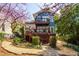 Back exterior with two-tiered wood deck and professionally landscaped backyard at 620 Wills Forest St, Raleigh, NC 27605