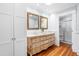 Elegant bathroom featuring a double sink vanity, ornate mirrors and a shower at 620 Wills Forest St, Raleigh, NC 27605