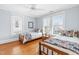 Sunny bedroom with hardwood floors, two twin beds and dresser with a view at 620 Wills Forest St, Raleigh, NC 27605