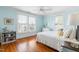 Well-lit bedroom with hardwood floors, neutral walls, and large windows at 620 Wills Forest St, Raleigh, NC 27605
