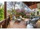 Relaxing deck features lounge chairs and peaceful views of the landscaped yard at 620 Wills Forest St, Raleigh, NC 27605