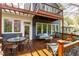 Outdoor deck with swing and seating, perfect for enjoying the backyard view at 620 Wills Forest St, Raleigh, NC 27605