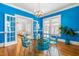 Stylish dining room with vibrant walls, hardwood floors, and elegant furnishings, great for entertaining at 620 Wills Forest St, Raleigh, NC 27605