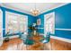 Bright dining room featuring colorful walls, a chandelier, and chic chairs for a modern touch at 620 Wills Forest St, Raleigh, NC 27605