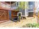 Back exterior with two-tiered wood deck, wood and brick accents, and landscaped yard at 620 Wills Forest St, Raleigh, NC 27605