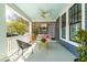 Inviting front porch with a swing, lattice screen, and stylish decor creating a relaxing outdoor space at 620 Wills Forest St, Raleigh, NC 27605