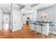 Open floor plan featuring kitchen with bar seating and view to entryway at 620 Wills Forest St, Raleigh, NC 27605