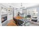 Living room with fireplace, hardwood floors, and view to open floor plan at 620 Wills Forest St, Raleigh, NC 27605