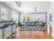 Bright living room with hardwood floors, large windows, and comfortable seating at 620 Wills Forest St, Raleigh, NC 27605