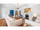 Bright living room with hardwood floors, a fireplace, and stylish furniture for comfortable living at 620 Wills Forest St, Raleigh, NC 27605