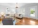 Inviting living room with hardwood floors, a decorative fireplace, and plenty of natural light at 620 Wills Forest St, Raleigh, NC 27605
