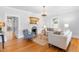 Bright living room featuring hardwood floors, a decorative fireplace, and elegant furnishings at 620 Wills Forest St, Raleigh, NC 27605