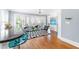 Open living room featuring hardwood floors, large windows, and stylish decor at 620 Wills Forest St, Raleigh, NC 27605