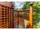 Modern outdoor shower features wood frame, black brick accents, and a convenient towel basket at 620 Wills Forest St, Raleigh, NC 27605