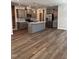 This kitchen has grey cabinets, an island, and stainless appliances, perfect for cooking and entertaining at 628 Brittany Ct, Durham, NC 27703