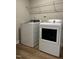 This laundry room has new appliances with laminate flooring and lots of extra space at 628 Brittany Ct, Durham, NC 27703