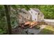 A spacious deck with outdoor furniture, surrounded by lush greenery, offering an inviting outdoor living space at 63 Tally Ho Dr, Selma, NC 27576