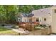 Enjoy the outdoors on this backyard deck with garden and privacy fence with access from several points on the house at 63 Tally Ho Dr, Selma, NC 27576