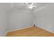 Clean, bright bedroom with hardwood floors and a ceiling fan, providing a comfortable space at 63 Tally Ho Dr, Selma, NC 27576