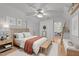 Bright bedroom with a comfortable bed, bench and simple, clean design at 63 Tally Ho Dr, Selma, NC 27576