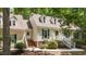 Charming home with green shutters, dormer windows, and a brick walkway leading to the inviting entrance at 63 Tally Ho Dr, Selma, NC 27576