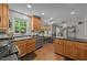 Spacious kitchen with stainless appliances, light wood cabinets, black counter tops, and a breakfast nook at 63 Tally Ho Dr, Selma, NC 27576