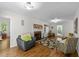 Cozy living room featuring a fireplace, hardwood floors, comfortable seating, and neutral color scheme at 63 Tally Ho Dr, Selma, NC 27576