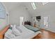Spacious primary bedroom features vaulted ceilings and access to a back deck at 63 Tally Ho Dr, Selma, NC 27576