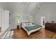 Spacious primary bedroom features vaulted ceilings, dual windows, and a walk-in closet at 63 Tally Ho Dr, Selma, NC 27576