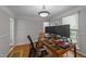 Bright home office featuring hardwood floors and a large window at 63 Tally Ho Dr, Selma, NC 27576