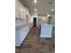 Open-concept kitchen with white cabinets, granite countertops, and stainless steel appliances at 644 Sweet Potato Lane # 36, Nashville, NC 27856