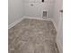Laundry room features neutral tile flooring and connections for washer and dryer hookups at 644 Sweet Potato Lane # 36, Nashville, NC 27856