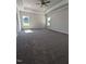 Spacious main bedroom featuring carpet and two windows that provide ample natural light at 644 Sweet Potato Lane # 36, Nashville, NC 27856