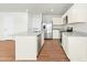 Bright kitchen with an island, stainless steel appliances, and granite countertops at 653 Corvair Ln, Wendell, NC 27591