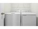 Bright laundry room featuring a modern washer and dryer appliance set at 653 Corvair Ln, Wendell, NC 27591