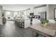 Open-concept kitchen featuring white cabinetry, stainless steel appliances, a kitchen island and an eat-in dining area at 713 Tambor Rd, Durham, NC 27713