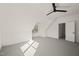 Attic bedroom features ceiling fan, window, neutral walls and carpet at 7950 Country Knoll Rd, Bahama, NC 27503